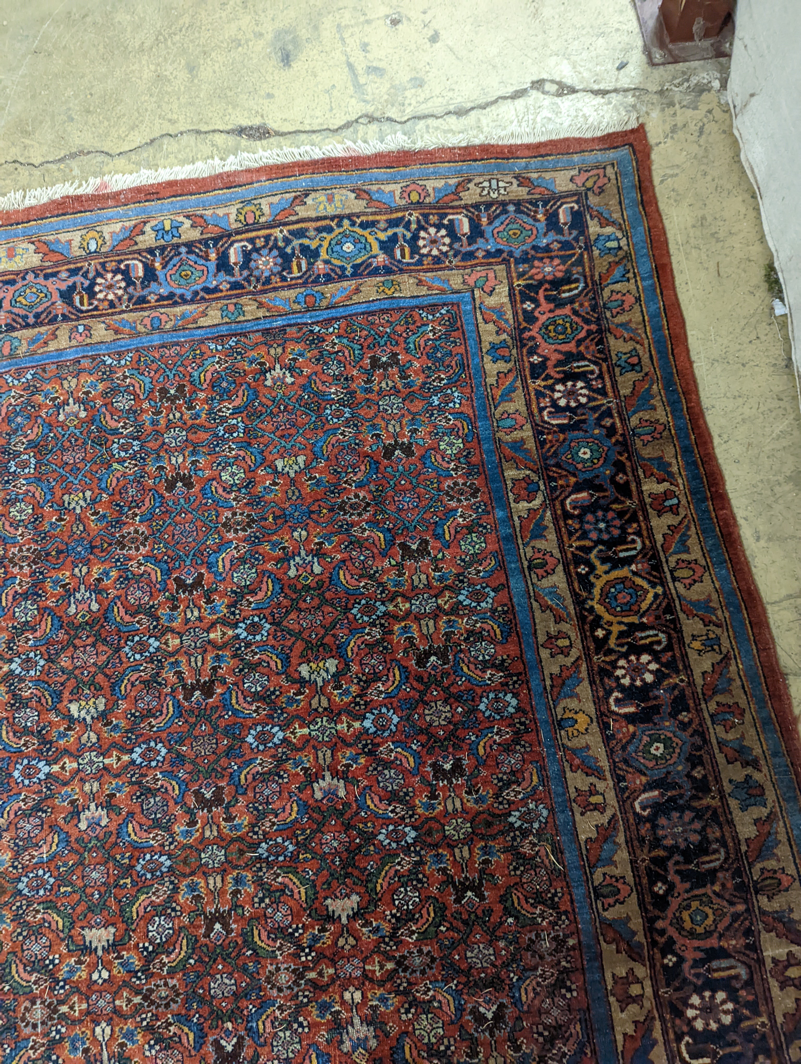 A North West Persian red ground carpet, 360 x 250cm